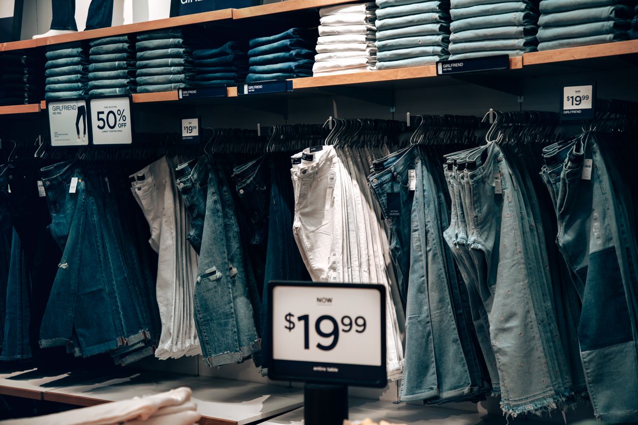 journey-01 Explore a stylish denim collection at a boutique in Miami, showcasing jeans with discounts.